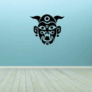 Tribal monkey mask decal with circular eyes and open mouth, black design
