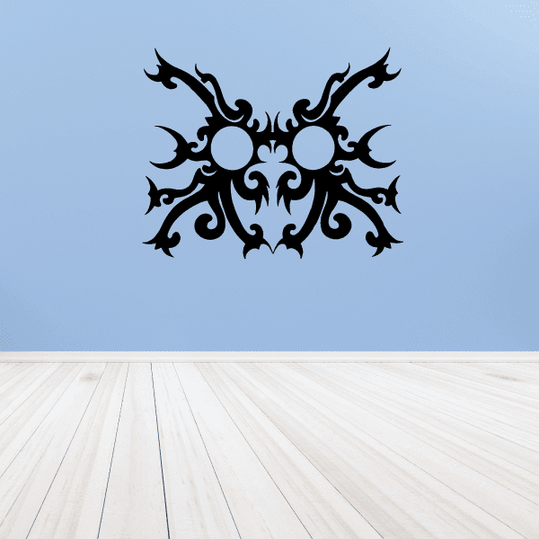 Tribal lightning sprite mask decal, black ornamental mask with two light-blue eyes