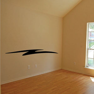 Tribal pinstripe wall decal in black with sweeping arrow-like stripes