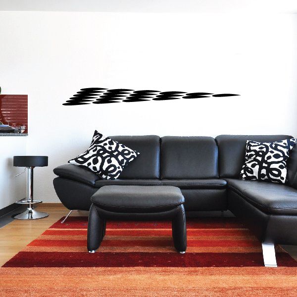 Tribal pinstripe wall decal with black geometric pattern on white wall