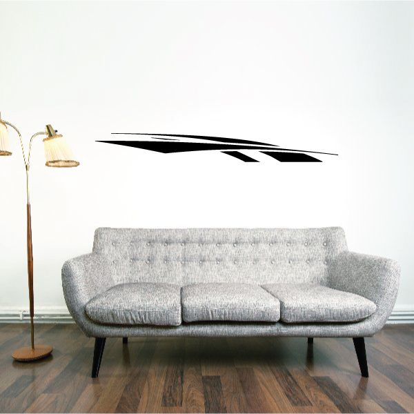 Tribal pinstripe vinyl wall decal with black streak design on a light wall