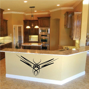 Tribal pinstripe vinyl wall decal, black tribal emblem on light surface