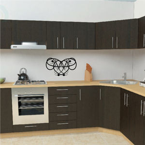 Tribal swirl wall decal in black vinyl, heart-shaped design with interlocking loops