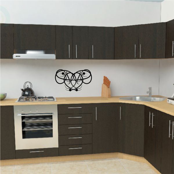 Tribal swirl wall decal in black vinyl, heart-shaped design with interlocking loops