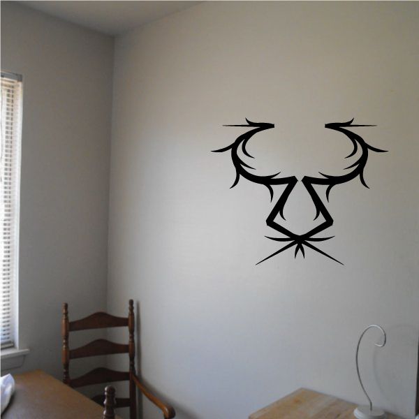 Tribal wall decal: black spiky emblem with shield and wing-like shapes