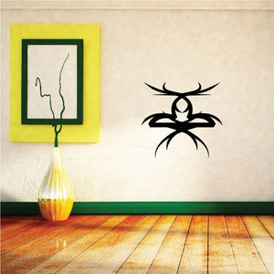 Black tribal pinstripe wall decal with spider-like silhouette and curved antennae