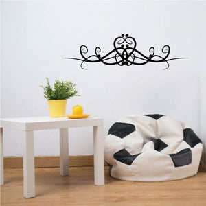 Black tribal scroll wall decal with central floral paw motif