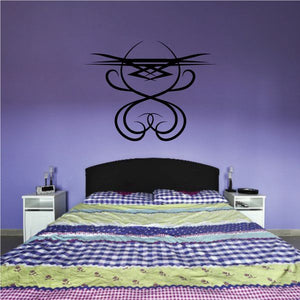 Tribal pinstripe wall decal with black symmetrical abstract emblem
