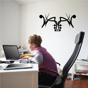 Black tribal pinstripe wall decal with central emblem and curved antler-like shapes
