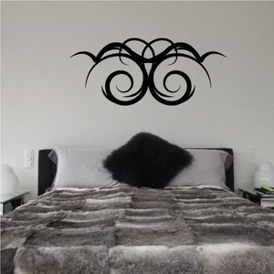 Tribal pinstripe wall decal with two black swirled eye shapes and curved lines