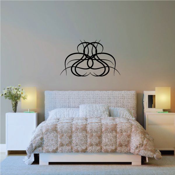 Tribal pinstripe wall decal with black knot-like design