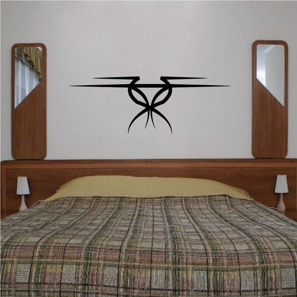 Tribal pinstripe wall decal with black tribal emblem and horizontal stripe lines