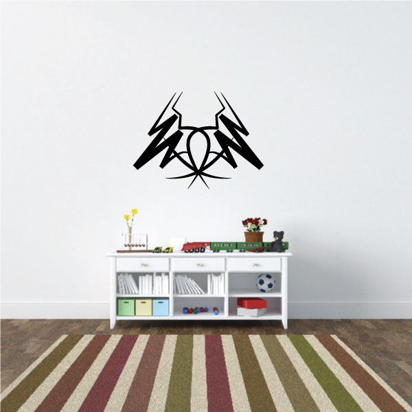 Tribal wall decal: black tribal emblem with angular rays and center circle