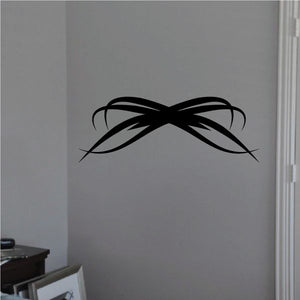 Tribal pinstripe wall decal, black winged bow design with sweeping lines.
