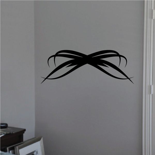 Tribal pinstripe wall decal, black winged bow design with sweeping lines.