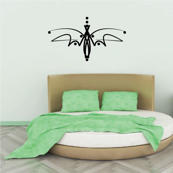 Black tribal butterfly wall decal with symmetrical swirls and fine line details