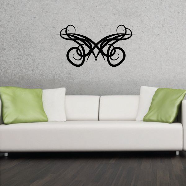 Tribal pinstripe vinyl wall decal, black scroll design on wall above sofa