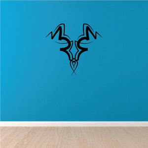 Tribal pinstripe vinyl wall decal with dark symmetrical emblem and fine linework
