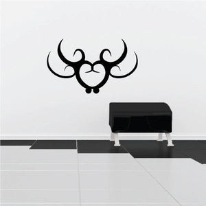 Black tribal bull head wall decal with ornate swirl horns and nose