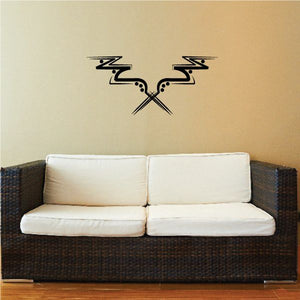 Tribal wall decal with black swirling design and arrows on a light wall