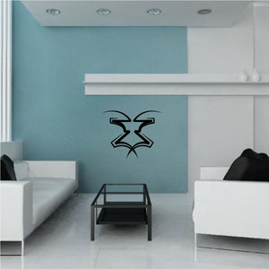 Tribal pinstripe wall decal with black outlined emblem on a light blue wall