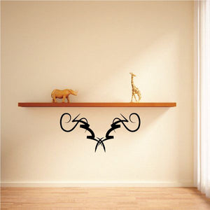 Tribal wall decal with black vine swirl pattern, symmetrical design for mounting