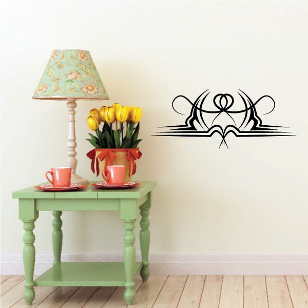 Tribal wall decal in black with swirling web-like pinstripe motif