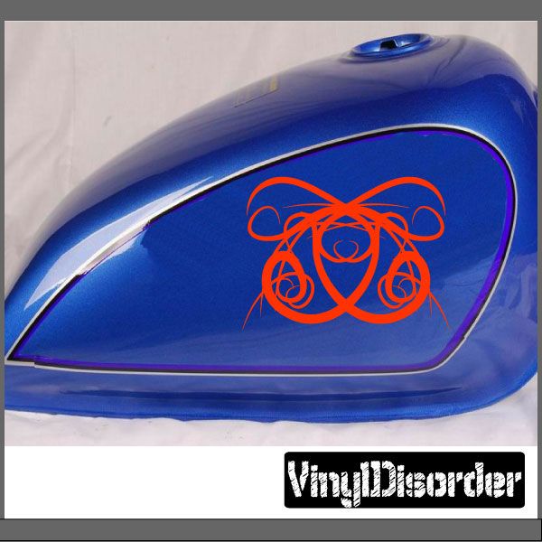 Vinyl tribal decal with red line-art design on a blue car panel