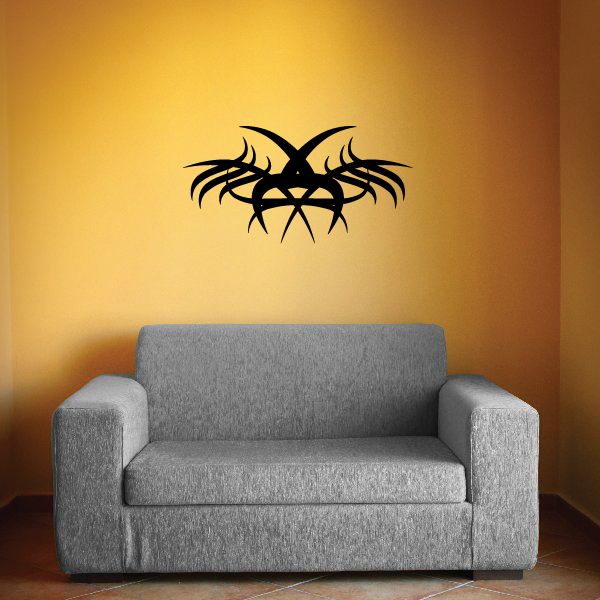 Tribal pinstripe wall decal: black spiky eye design with gold accents