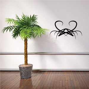 Black tribal spider wall decal with pinstripe lines and curved legs