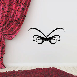 Black tribal butterfly vinyl wall decal with curled wing outlines