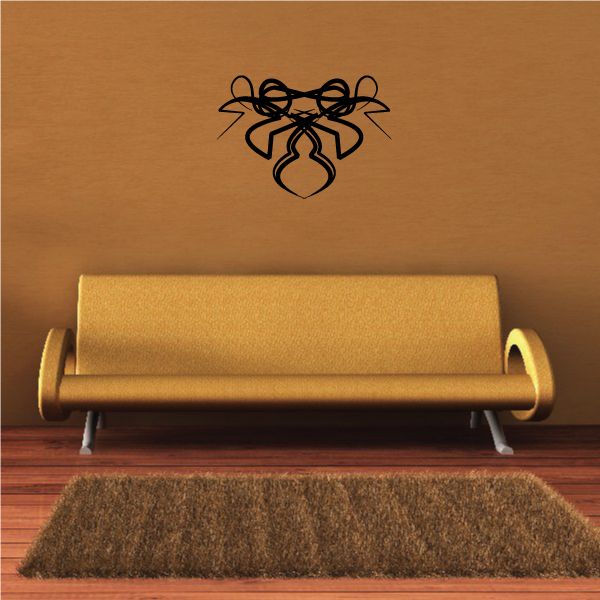 Tribal wall decal with black ribbon-like knot and swirl design