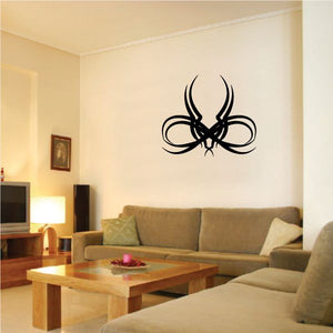 Tribal pinstripe wall decal: black tribal emblem with ribbon-like swirls and curved shapes.