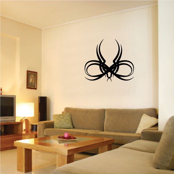 Tribal pinstripe wall decal: black tribal emblem with ribbon-like swirls and curved shapes.