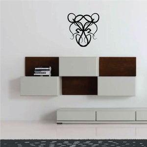 Tribal wall decal with black abstract swirl line art on a light wall
