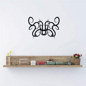Black tribal graffiti-style wall decal with swirling pinstripe letters