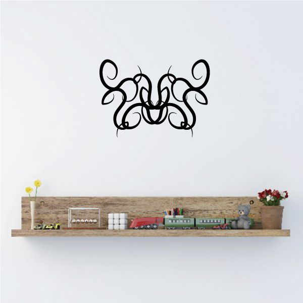 Black tribal graffiti-style wall decal with swirling pinstripe letters