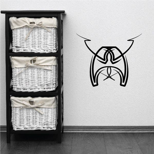 Tribal pinstripe vinyl wall decal with black stylized emblem and curved lines