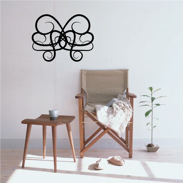 Tribal pinstripe vinyl wall decal with black butterfly-like swirl outline