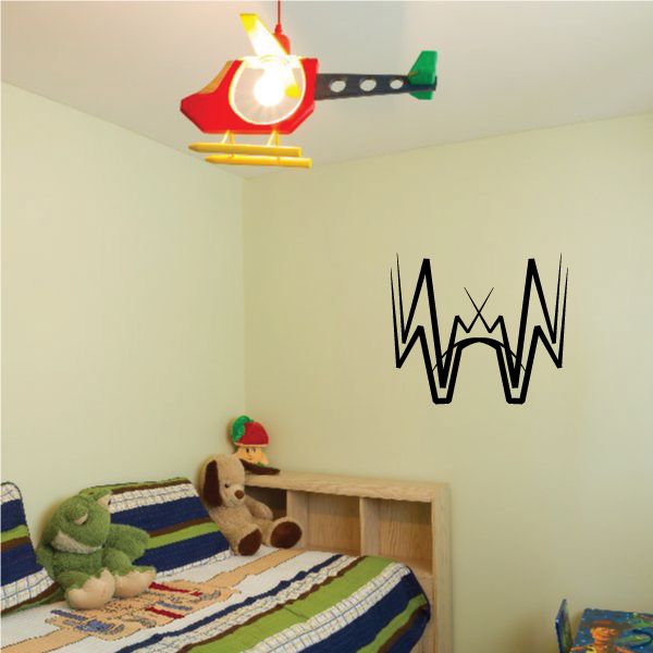 Tribal wall decal with black heartbeat-style W symbol on light wall
