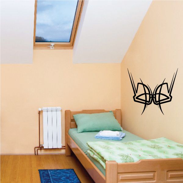 Tribal pinstripe vinyl wall decal in black on light beige wall