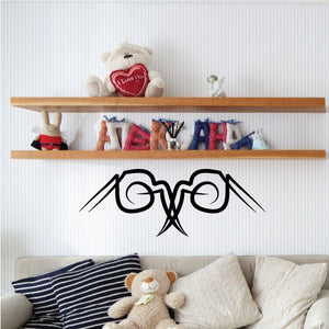 Black tribal wall decal with arched pinstripe-like design and winged ends