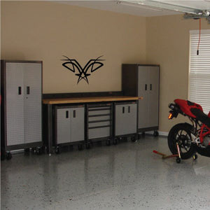 Black tribal wall decal with pinstripe style swirl star shape on wall