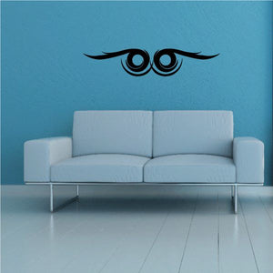 Tribal pinstripe wall decal with black eye motif and feather wings
