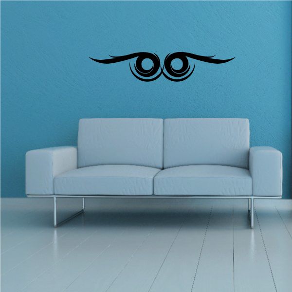 Tribal pinstripe wall decal with black eye motif and feather wings
