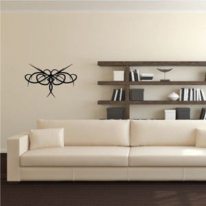 Tribal wall decal with black swirling lines on a light wall
