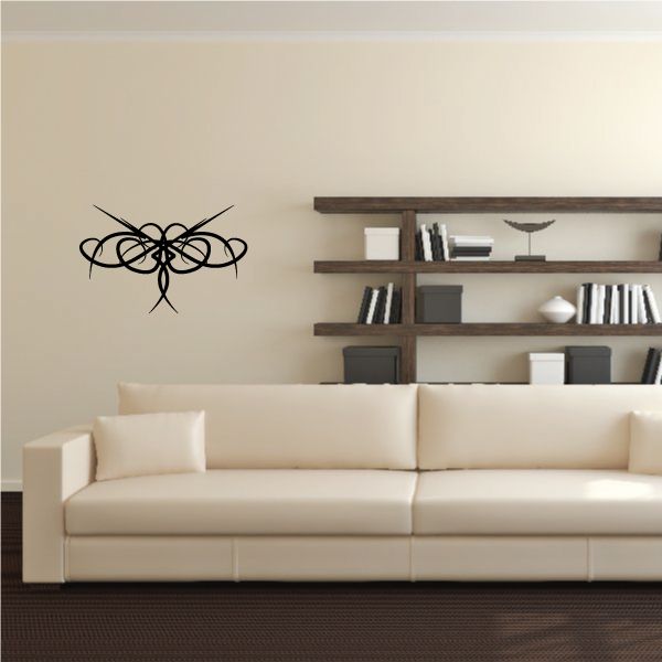 Tribal wall decal with black swirling lines on a light wall