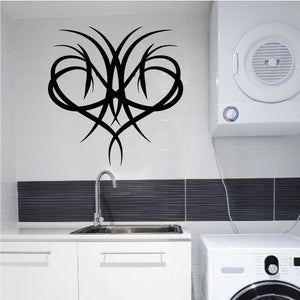 Black tribal pinstripe wall decal with symmetrical ornate swirl design