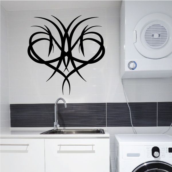 Black tribal pinstripe wall decal with symmetrical ornate swirl design