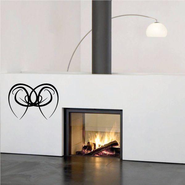 Tribal vinyl wall decal with black swirl heart-like pattern, set of lines and curves